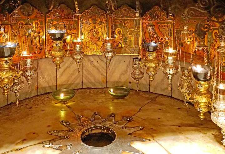 The fourteen-pointed silver star in the floor of the Grotto of the Nativity, marking the traditional place of the birth.