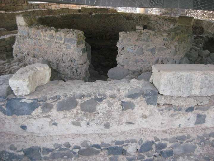 The ruins identified as the house of Peter, at ancient ground level in Capernaum.