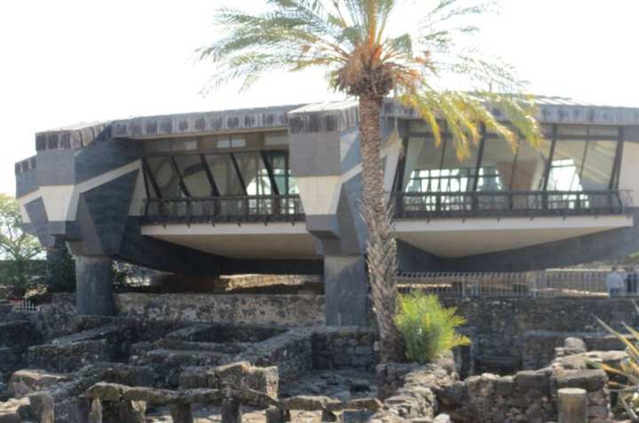 The house of Peter and the synagogue at Capernaum, seen together.