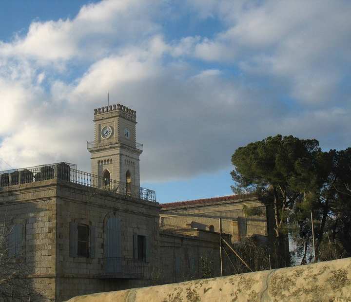 The Franciscan convent at El-Qubeibeh, with its clock tower, beside the church of Saint Cleophas.