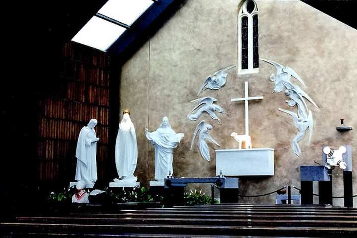 The parish church and the Apparition Chapel together.