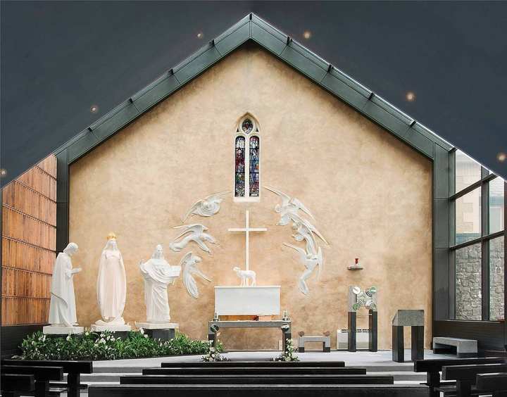 Our Lady of Knock — Knock, County Mayo. The Apparition Chapel at Knock: the white figures of Our Lady, Saint Joseph, and Saint John, the Lamb on the altar, angels on the gable wall.