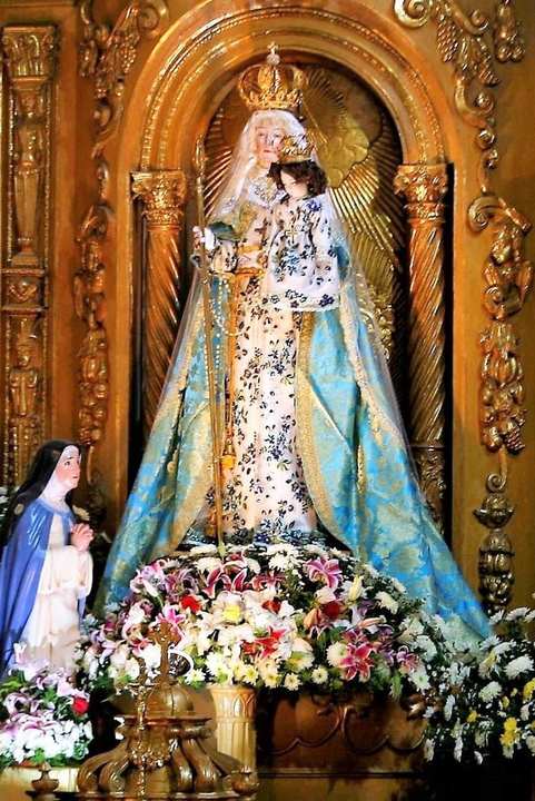 Our Lady of Good Success — Quito. The official statue of Our Lady of Good Success in Quito: a standing Madonna and Child in gold and white, a crown, a staff, the keys of the convent.
